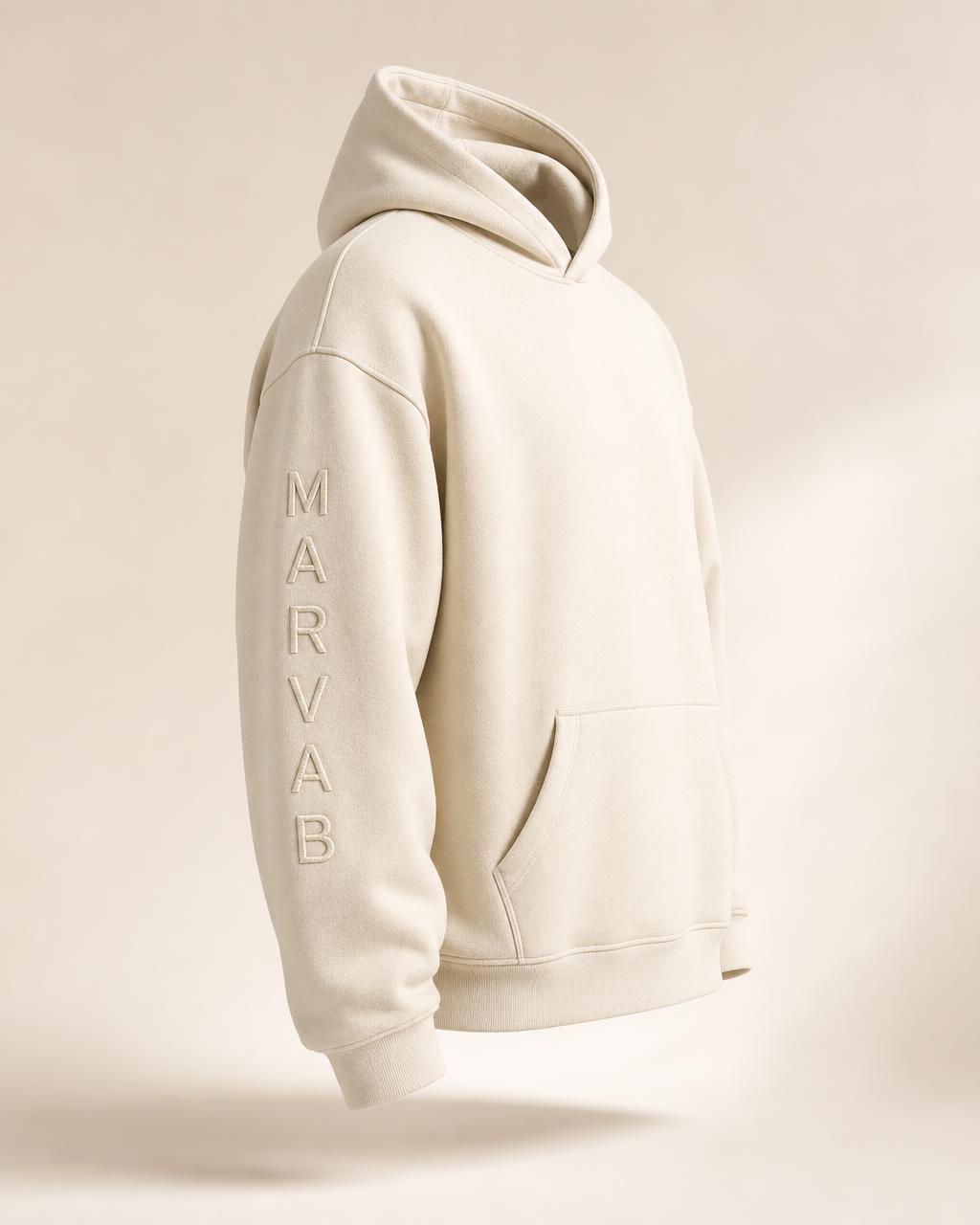CORE 001 hoodie in Bone with the MARVAB wordmark embroidered vertically down the left sleeve
