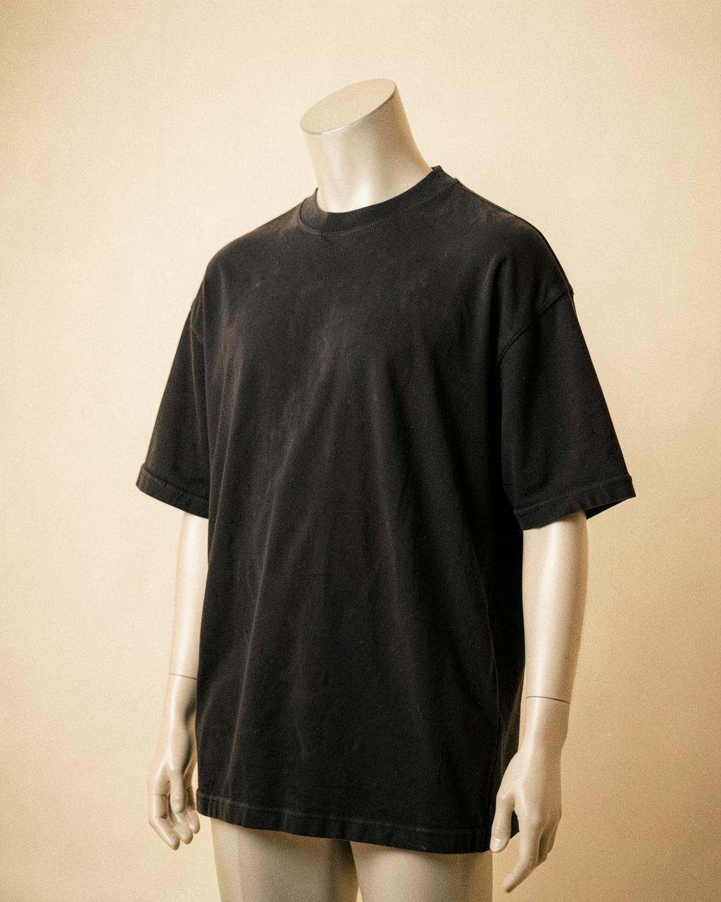Everyday Tee — Washed Black — studio shot showing the vertical MARVAB sleeve embroidery